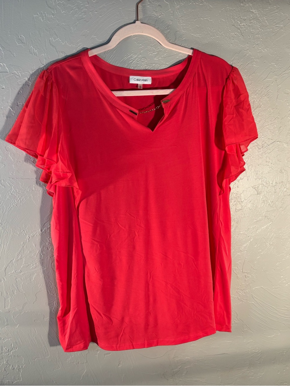 Calvin Klein Coral Pink V-Neck Ruffle Sleeve Top with Chain Accent
